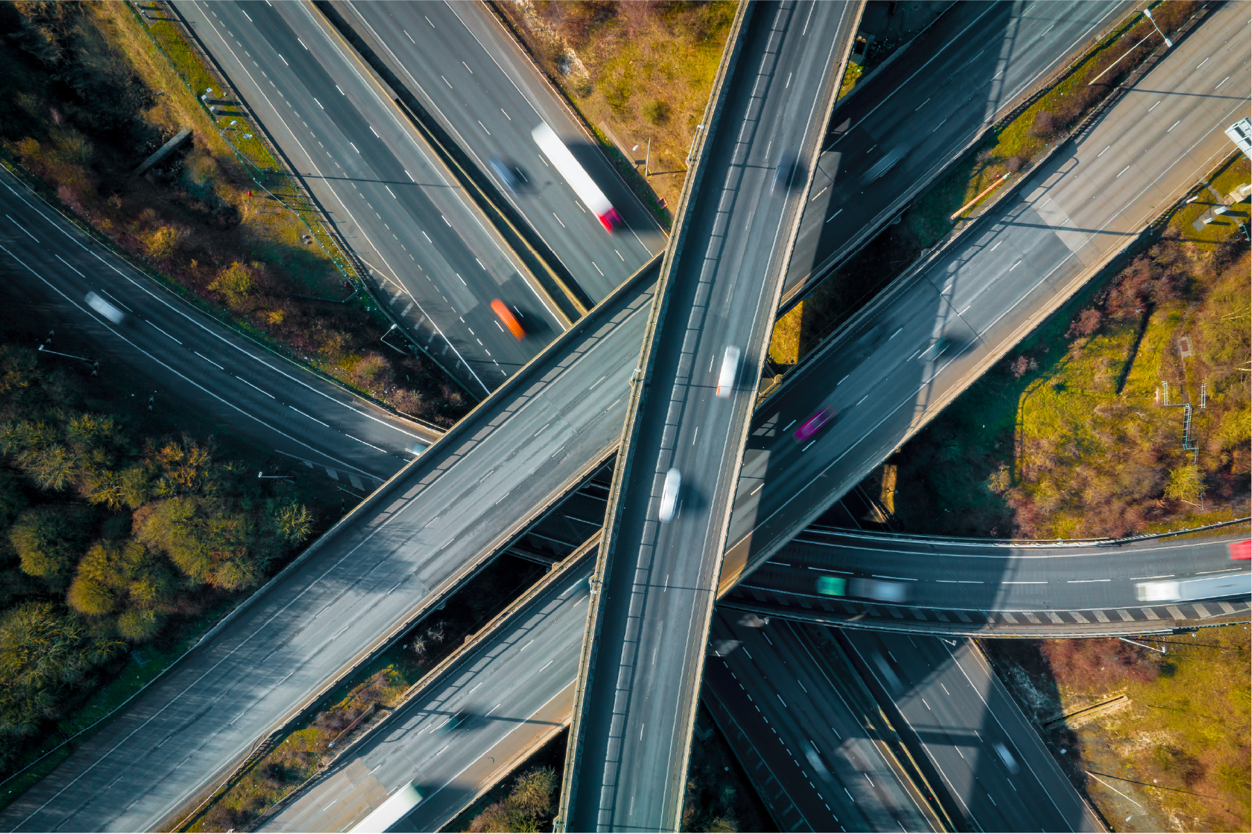 Aerial view of a motorway interchange with flowing traffic