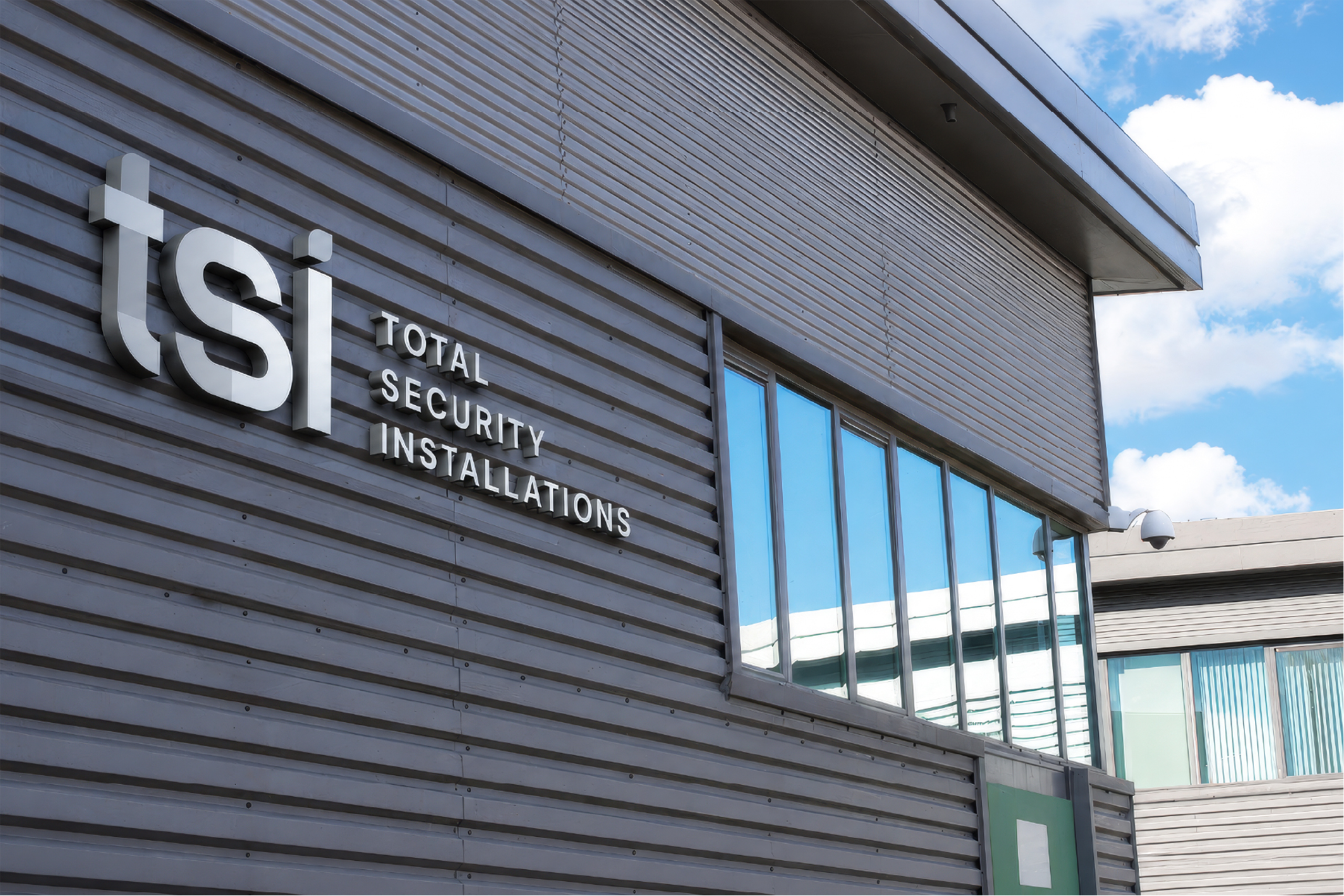 TSI Total Security Installations signage on the side of a building